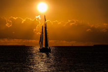 Yacht In The Sea During Golden Sunset