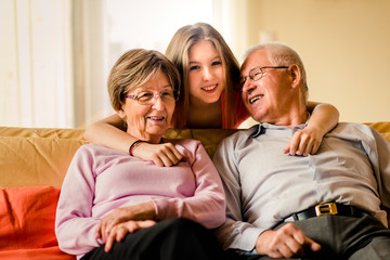 Grandchild with grandparents at home