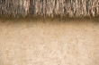 straw thatched roof  and  soil wall background