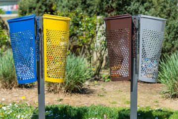 Wall Mural - colored bins on the street