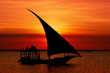 Fishermen Dhow Boat coming back home at sunset from a long day in the sea.