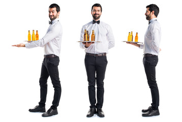 Wall Mural - Waiter with beer bottles on the tray