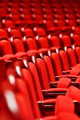 Rows of empty red velvet seats