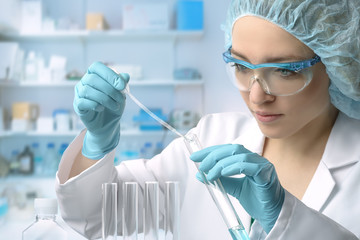 Young female tech or scientist performs protein assay