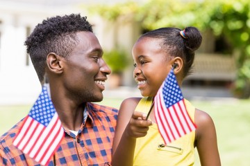 Wall Mural - Happy family showing usa flag