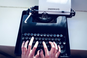 Wall Mural - Password: against womans hand typing on typewriter