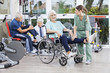 © Tyler Olson - Physiotherapists Guiding Senior Patients To Exercise At Rehab Ce