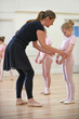 © highwaystarz - Group Of Young Girls With Teacher In Ballet Dancing Class