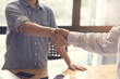 © 88studio - businessman handshaking for business acquisiton concept