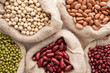 © kireewongfoto - Assortment of beans and lentils in hemp sack on wooden backgroun