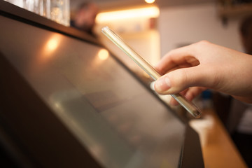 Girl is using a smarphone to pay