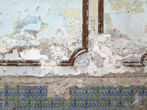 Abandoned House Havana / Detail of a decrepit wall with paint and tiles, found in an abandoned house. Havana, Cuba. Light, natural colors. © olivier vancayzeele