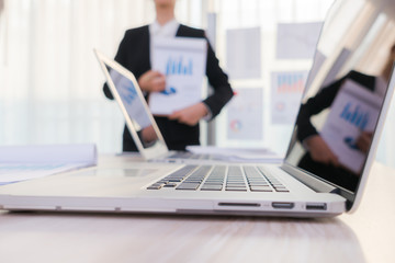 Business people using laptop  and Financial charts  at meeting o