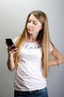 © patramansky - Young pretty woman with mobile phone chatting typing sms