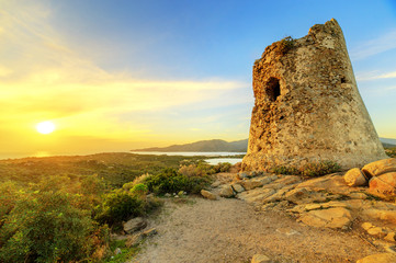 Wall Mural - Susnet over old tower with a panoramic view of Villasimius, Sardinia