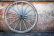 Old ironed, blue wagon or carriage wheel