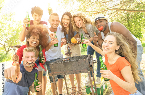 Fotografie, Obraz Happy multiracial friends having fun at barbecue garden party - Young people eat