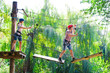 © davit85 - adventure climbing high wire park - people on course in mountain