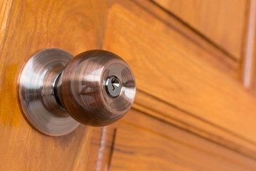 Wall Mural - door knob and keyhole on wooden door