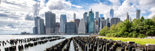 New York City NYC Manhattan Island Skyline Panorama Scenic View. Banner Crop Of Waterfront Lifestyle For Advertisement Copyspace. Downtown Cityscape From The Brooklyn Bridge Park Pier 1 Salt Marsh. 
