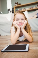 Poster - Portrait of smiling girl with digital tablet 