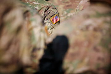 usa flag and us army patch on solder's uniform