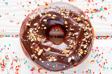 Wall Mural - donut in chocolate glaze on a white background