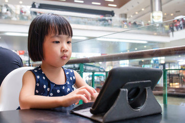 Asian Little Chinese Girl Looking at Digital Tablet