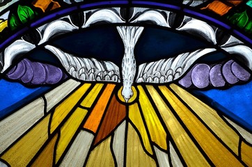 stained glass window depicting Pentecost