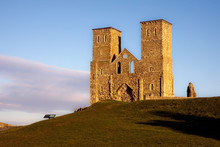 Remains Of Reculver Church Towers Bathed In Late Afternoon Sun In Winter