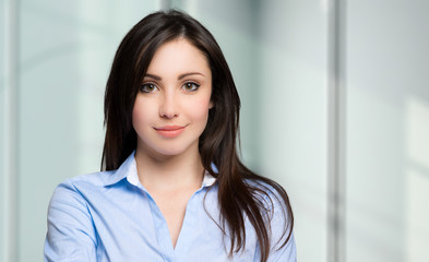 Young businesswoman portrait in a modern office