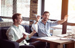 © zinkevych - Positive colleagues playing with paper planes