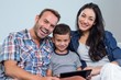 © WavebreakmediaMicro - Mother, father and son using digital tablet
