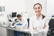 Cheerful female researcher is evincing positive emotions