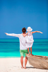 Wall Mural - Little girl and young father during tropical beach vacation