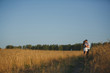 © Diflope - romantic happy couple go on a wheat field.