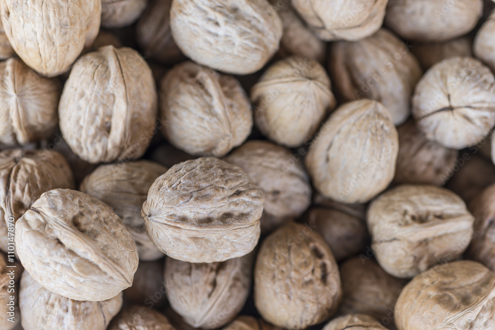 Walnuts in shells on a market
