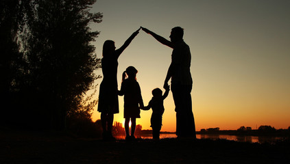 silhouette of a happy family with children