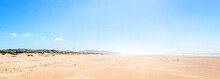 Panoramic View Of The Huge Beach Of Nehalem Bay State Park On The West Coast Of America With Some People Walking At The Edge Of The Sea During A Sunny Day Of Summer
