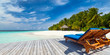 sun lounger bed on jetty in front of paradise island and beach / Sonnenliege auf Steg vor Insel Paradies mit Traumstrand Strand