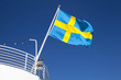 © evannovostro - Swedish flag waving over blue sky