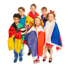 Wall Mural - Top view of kids wrapped in European nations flags