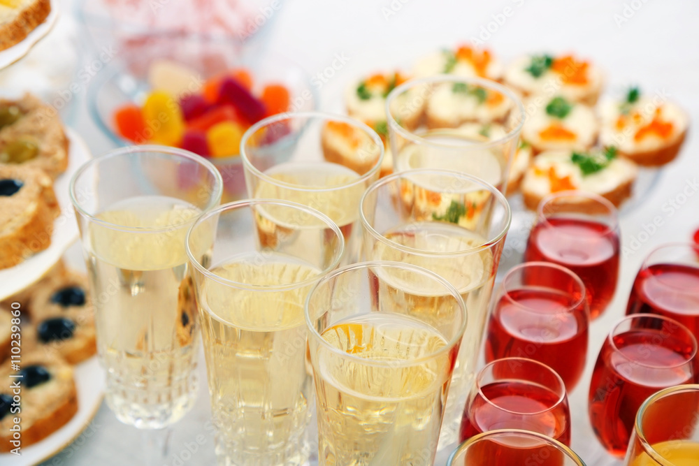 Set of cold snacks, canape, beverages, closeup