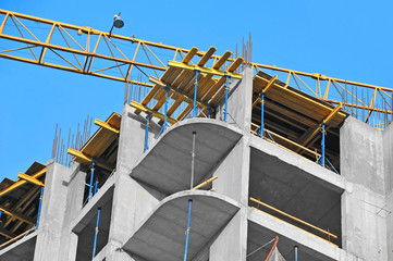 Crane and highrise construction site