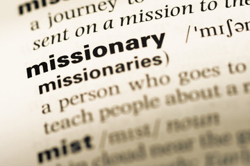Wall Mural - close up of old english dictionary page with word missionary