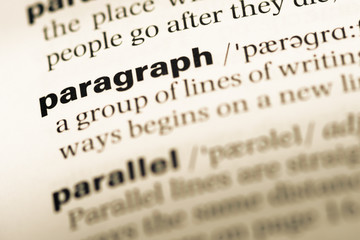 Wall Mural - close up of old english dictionary page with word paragraph
