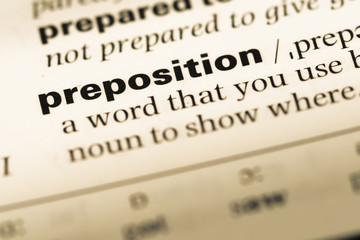 Wall Mural - close up of old english dictionary page with word preposition