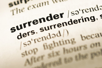 Wall Mural - close up of old english dictionary page with word surrender