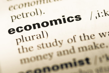 Wall Mural - close up of old english dictionary page with word economics