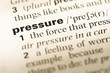 © TungCheung - Close up of old English dictionary page with word pressure